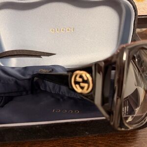Gucci Black and Gold women’s sunglasses.